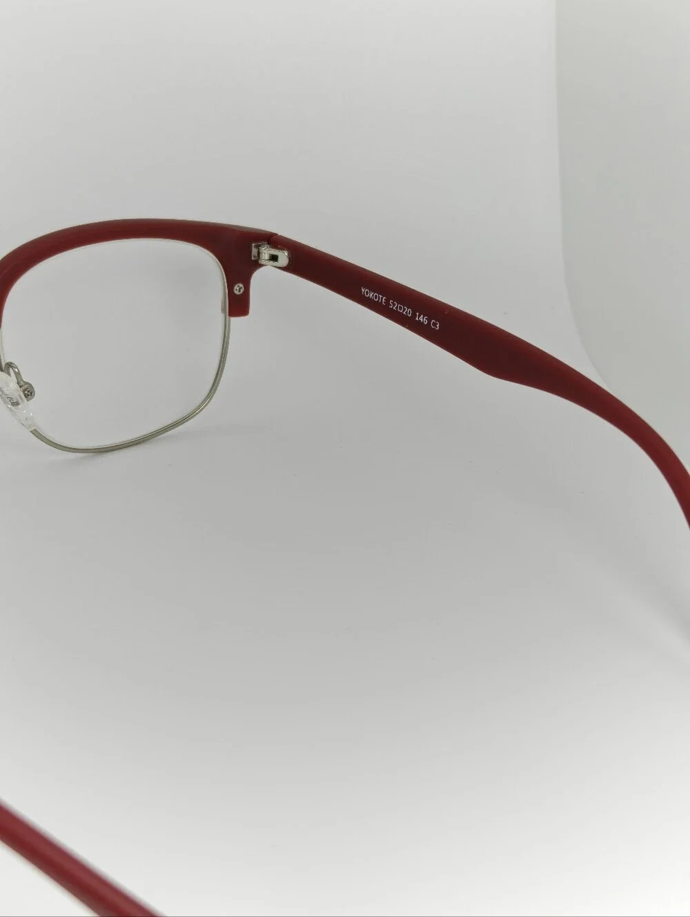 Yokote. Red Half-Rim Women's Eyeglasses - Classic Metal Frame.